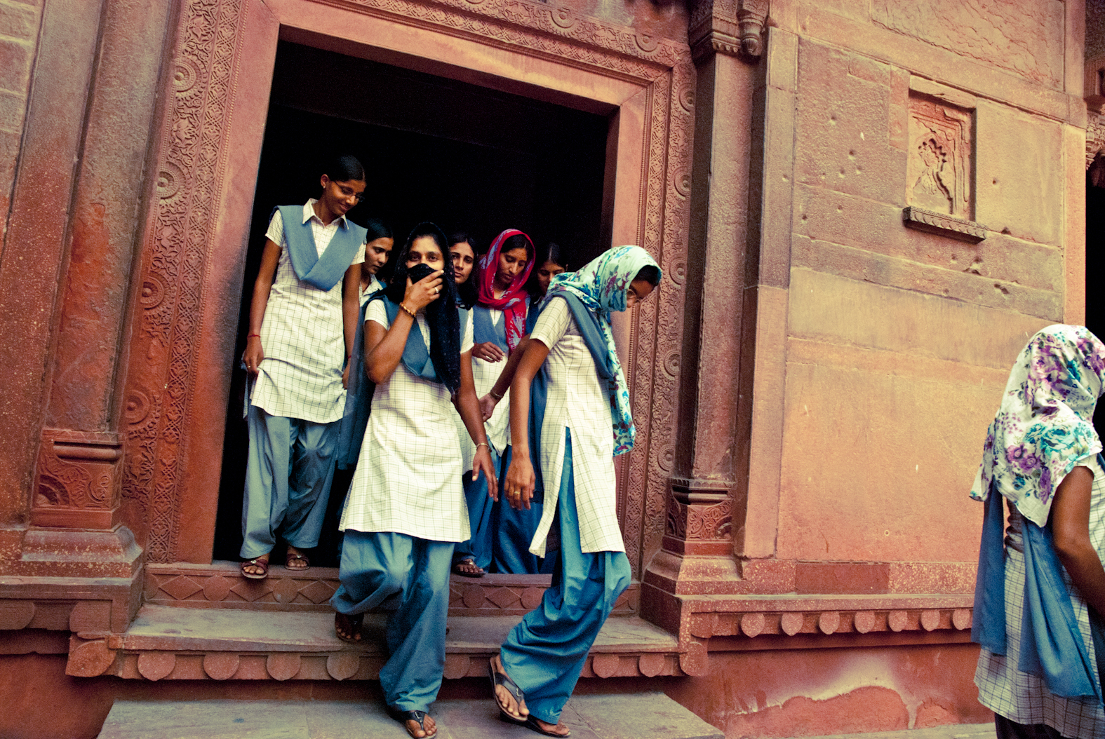People at a carved doorway