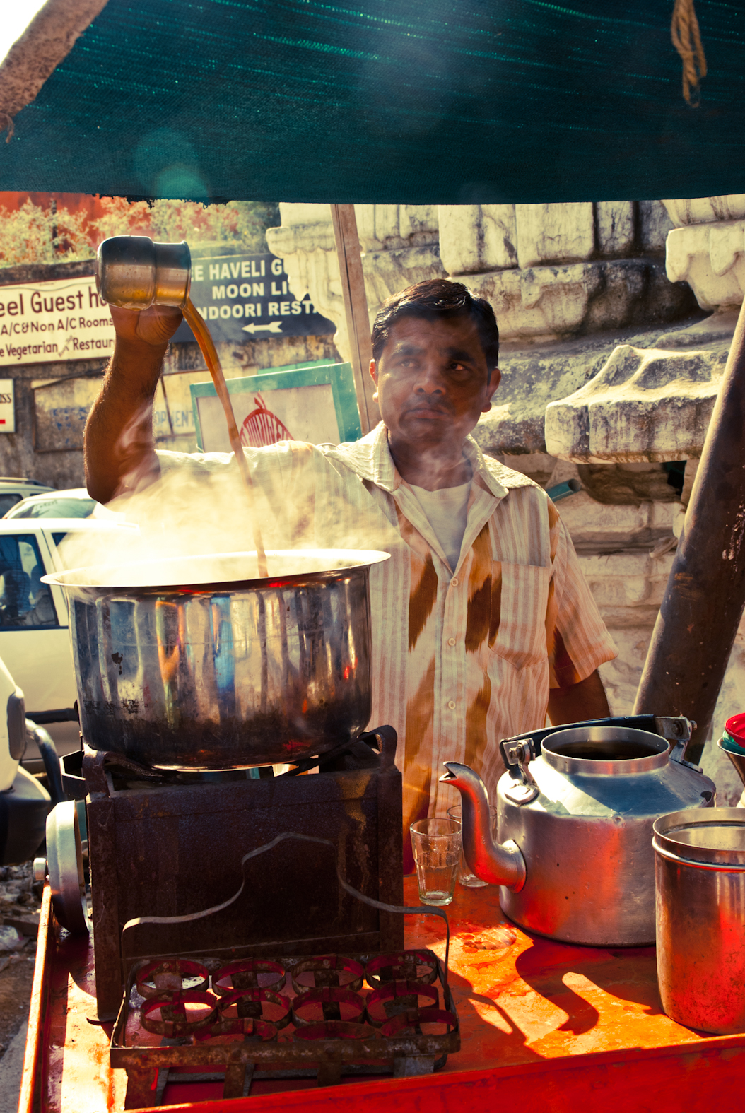 A person working beside steaming containers