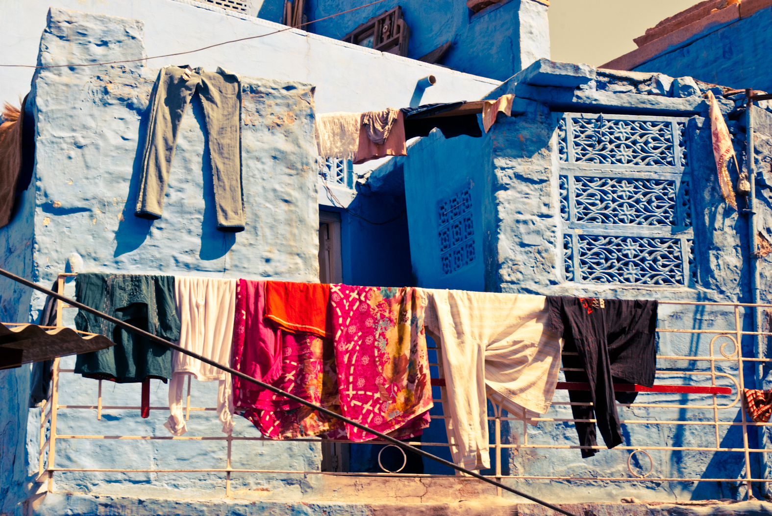 Laundry hanging in front of blue walls