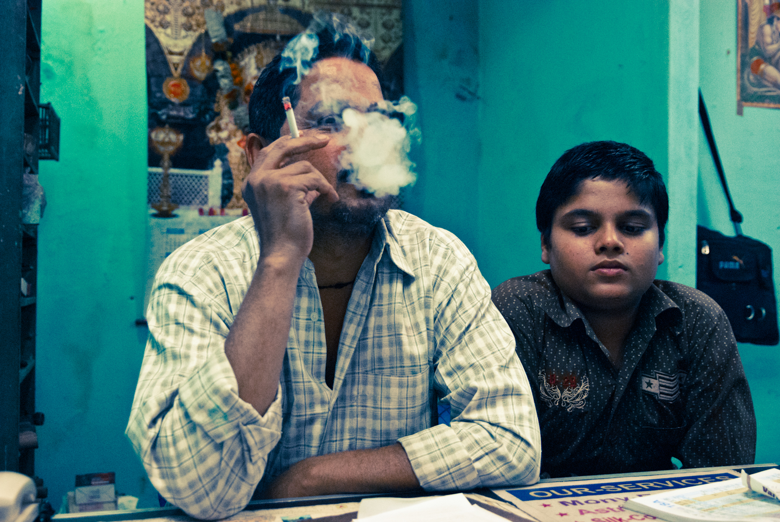 Smoke obscuring a face beside a child