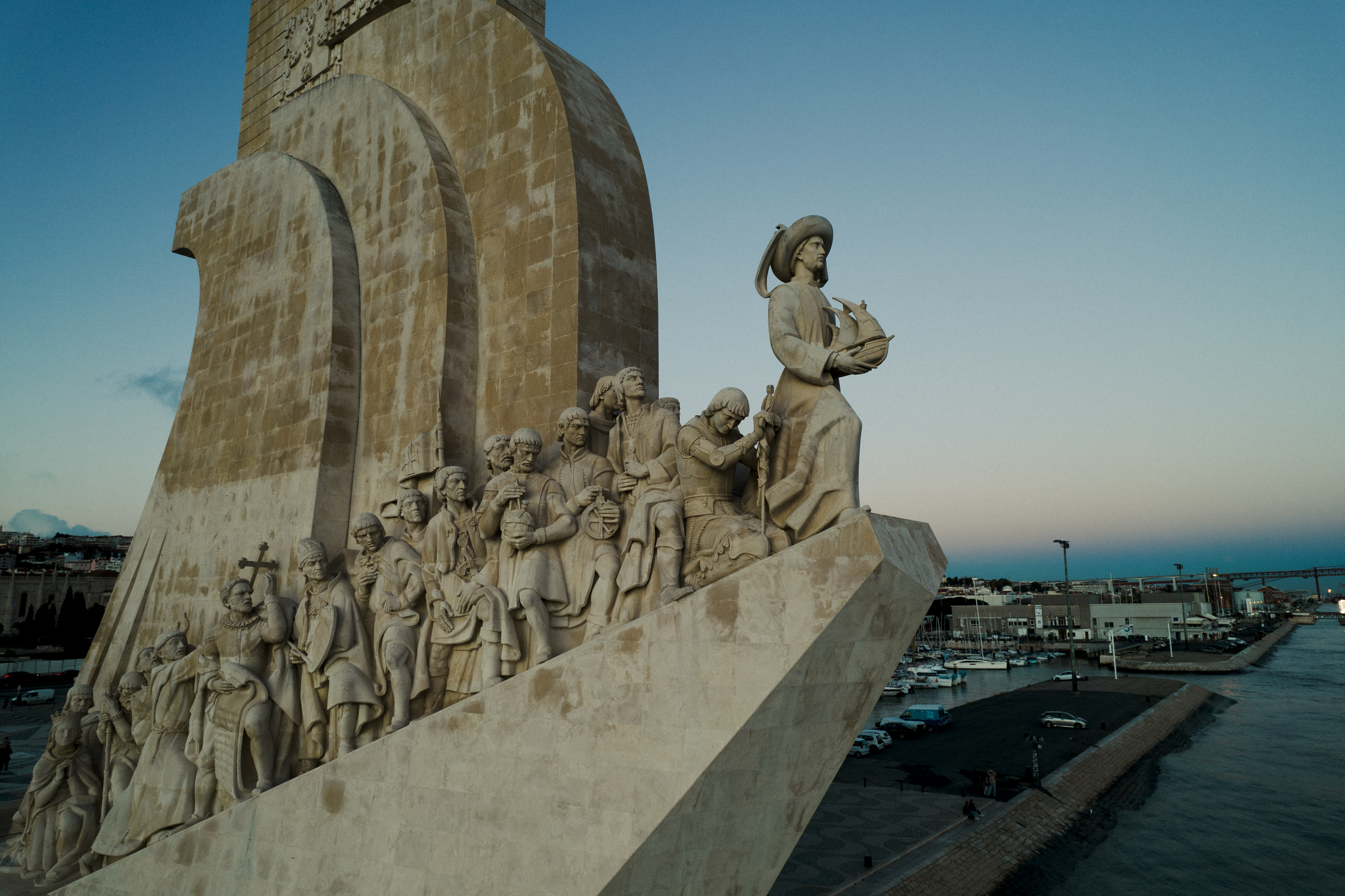Carved stone figures by the waterfront